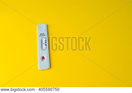 Test For Coronavirus Lies On A Yellow Background. Bright Picture. Testing For Coronavirus. Detection