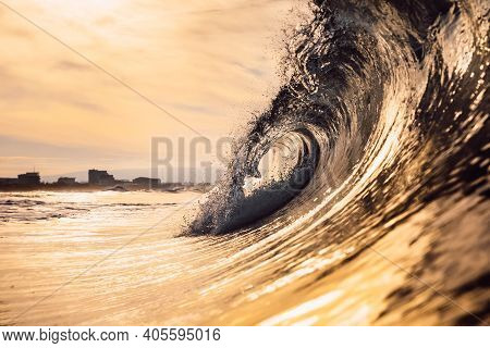 Glassy Wave At Sunrise. Breaking Ocean Wave With Warm Colors, Swell For Surfing