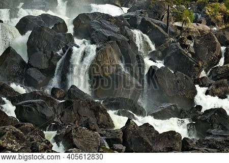 Russia. Mountain Altai. A Fragment Of The Uchar Cascade Waterfall On The Chulcha River, The Right Tr
