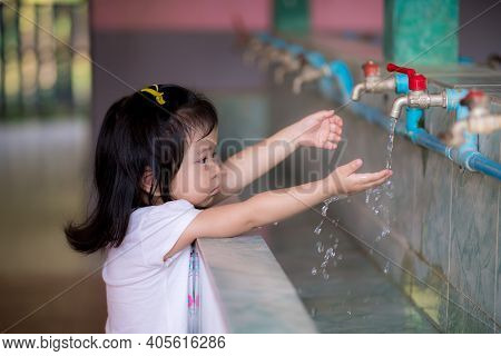 Asian Little Kid Girl Washing Her Hands.
