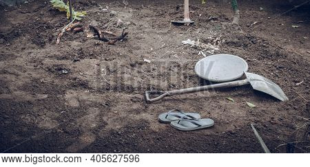 Steel Rusty Shovel Lay In The Ground, Home Garden Renovation And Workers Take A Break,