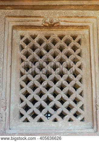 Aihole, Karnataka, India - November 7, 2013: Durga Gudi Or Temple. Gray Stone Window Screen Showing 
