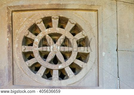 Aihole, Karnataka, India - November 7, 2013: Durga Gudi Or Temple. Gray Stone Window Screen Showing 