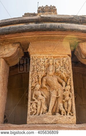 Aihole, Karnataka, India - November 7, 2013: Durga Gudi Or Temple. Red-brown Stone Fresco Outside Wa