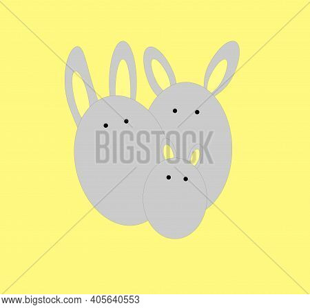 Easter Eggs With Rabbit Ears On A Yellow Background Gray Rabbits In The Shape Of Eggs