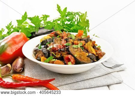 Ragout With Eggplant And Pepper On White Board