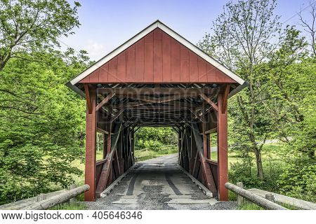The Historic Red Erskine Covered Bridge Crosses Middle Wheeling Creek In Rural Washington County, Pe