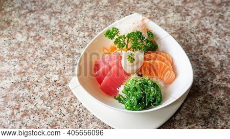 Japanese Rice With Mix Sashimi Don In A White Bowl.