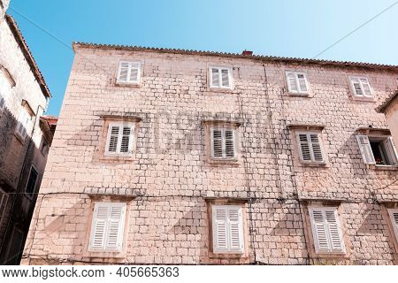 The Old Town Of Trogir On Sunny Summer Day. White Brick Wall With Windows. Architecture Of Trogir Ol
