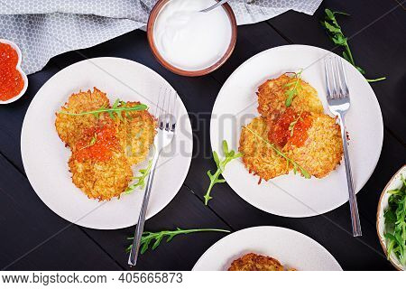 Fried Potato Pancakes With Red Caviar And Sour Cream, Fritter, Roesti. Traditional Delicious Food, L