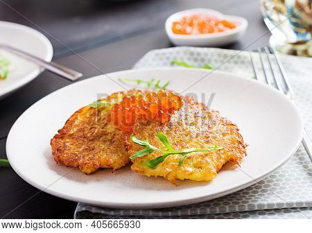 Fried Potato Pancakes With Red Caviar And Sour Cream, Fritter, Roesti. Traditional Delicious Food, L