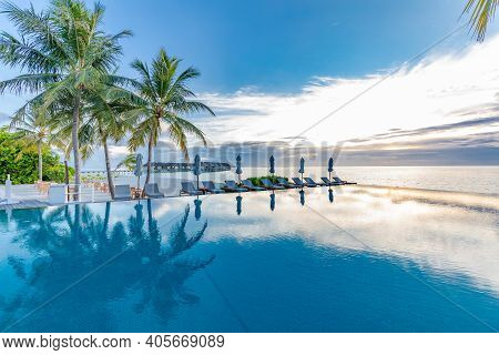 Beautiful Poolside And Sunset Sky. Luxurious Tropical Beach Landscape, Deck Chairs And Loungers And 