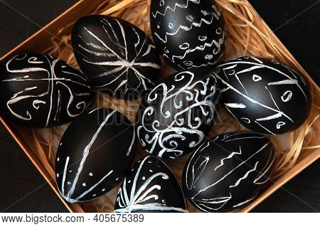 Creative Trendy Painted Easter Eggs On Black Background. Easter Ideas. Background With Easter Eggs.