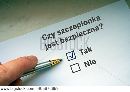 Hand With Black Pen Marking On Checklist Box. Polish Question \