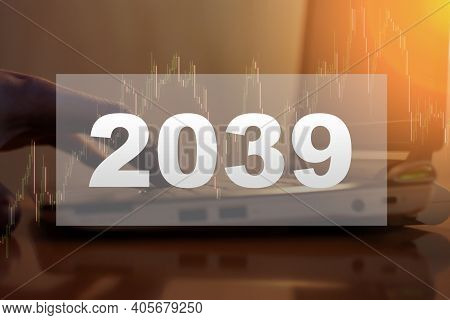 2039 Holiday Text On The Background Of A Man Working In The New Year
