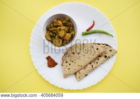 Selective Focus Of Indian Side Dish Curry Aloo Mattar Ki Sabzi, Popular Curry Made Of Potatoes And G