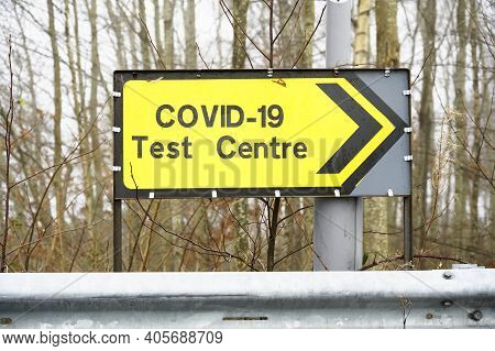 Covid-19 Test Centre Sign At Road With Traffic Cones