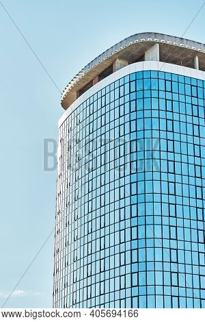 High New Skyscraper Building Top Against Clear Blue Sky