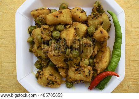 Selective Focus Of Indian Side Dish Curry Aloo Mattar Ki Sabzi, Popular Curry Made Of Potatoes And G