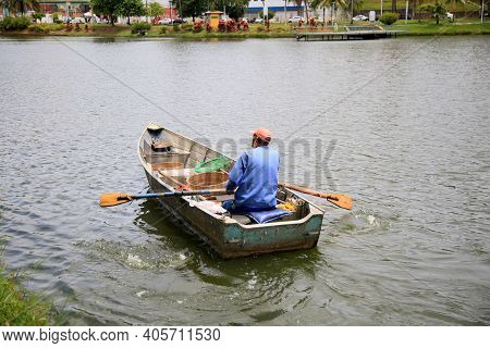 Fisherman On Lake Fishing