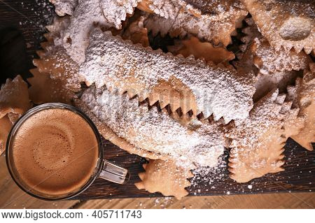 Carnival Food Typical And Aromatic Coffee On A Woody Background. Sfrappole Or Chiachiere Or Angel Wi