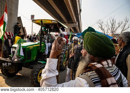 January 2021 Delhi , India
Huge Number Of Tractor With Indian Flag Going For Tractor Rally During Fa