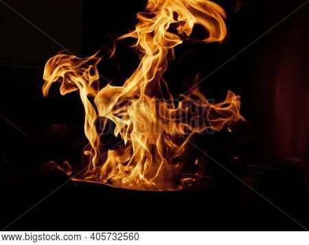 Flambe Chef Cooking In Kitchen. Professional Chef Flambe Style.