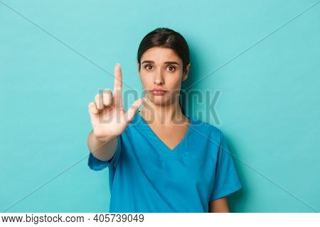 Coronavirus, Social Distancing And Health Concept. Close-up Of Serious Doctor Forbid Something Durin