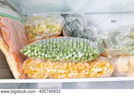 Assortment Of Frozenvegetables In Home Fridge. Frozen Food In The Freezer