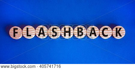 Flashback Symbol. Wooden Circles With The Word 'flashback'. Beautiful Blue Background. Business And 
