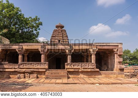 Aihole, Karnataka, India - November 7, 2013: Chakra Gudi Temple Building In Brown Stone Under Blue C