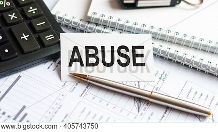 Writing Text Abuse On White Paper Card, Black Letters, White Background. Business Concept.