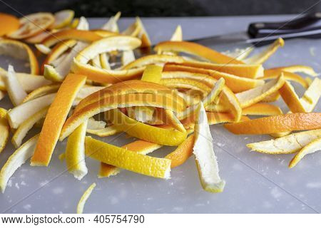 Slices Of Orange And Lemon Peels On A Cutting Board For The Preparation Of Making Them Into Candied 