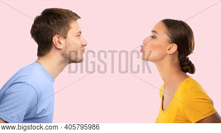 Love And Bonding. Profile Side View Photo Portrait Of Beautiful Couple Reaching To Each Other And Tr