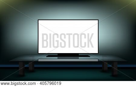 White Tv Screen In Darkness In Room On Glass Table