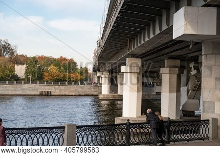 Supports Of The Metro Of The Bridge Across The Moskva River, Metal Fence Of The Embankment With Gran
