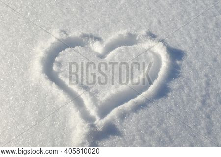 Heart Is Drawn In Snowy Glade. Background For Decoration For Holiday Of Valentine\'s Day. Cold Heart