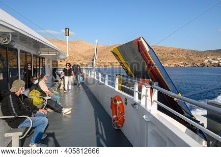 Sikinos, Greece - September 23, 2020: Tourist Sitting On Bench Of Ferry. Coast Of Sikinos Island In 
