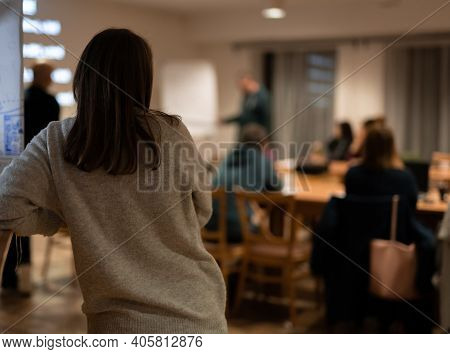 Woman From Behind During Meeting With Coworkers