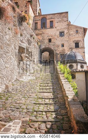 Narrow Cobbled Street Leading To The Castle Of Bolsena, Lazio, Italy