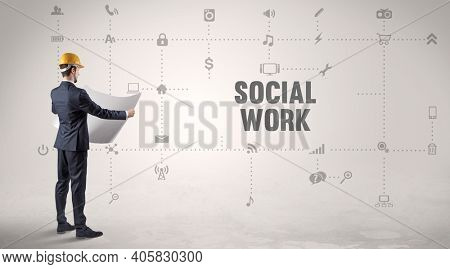 Engineer working on a new social media platform with SOCIAL WORK inscription concept