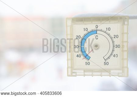Outdoor Thermometer Showing Extremely Cold Temperature. Winter Cold Weather In Siberia. Selsius Scal