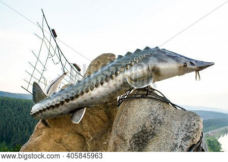 Monument To Sturgeon Fish Living In The Yenisei River. Dedicated To The Story Of The Writer Astaviev