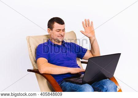 A Man With A Hearing Aid Communicates Non-verbally Via Webcam On Video Online Communication, Senior 