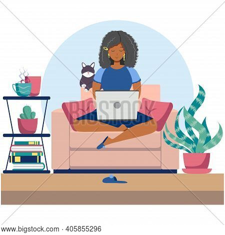 Young Black Woman Sitting On Chair With Laptop Computer In Cozy Room. Daily Life Of Freelance Worker