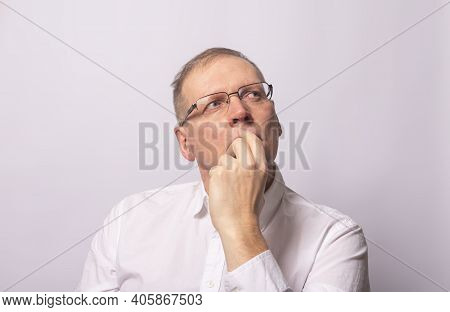 Adult Man With Hand On Chin Staring And Thinking. Serious Businessman
