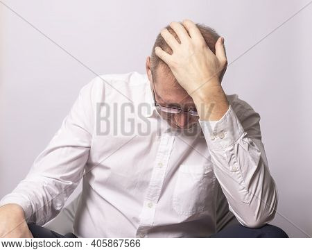 Depressed Businessman In Anxiety With Hand On Head. Tired Man In Panic. Worrying Human