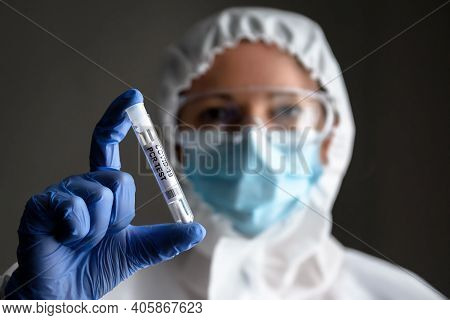 Covid-19 Swab Collection Kit In Doctor's Hand, Nurse In Medical Ppe Suit Holds Tube Of Coronavirus P