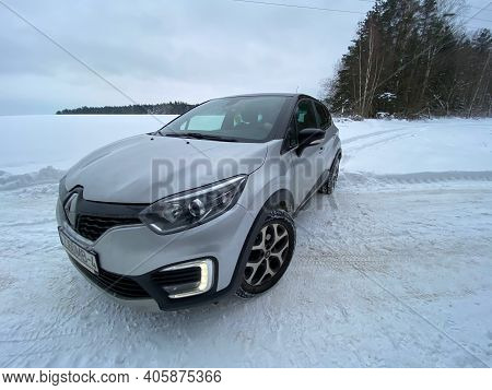 Grodno, Belarus-01.31.2021: Renault Capture Or Renault Captur Suv On A Winter Road Against The Backg