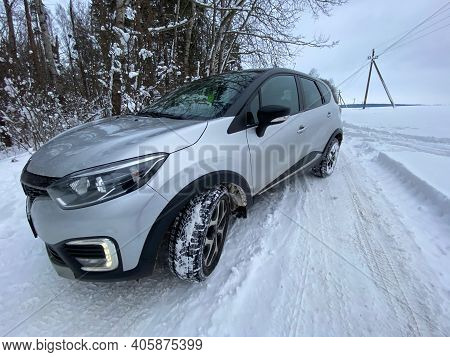 Grodno, Belarus-01.31.2021: Renault Capture Or Renault Captur Suv On A Winter Road Against The Backg